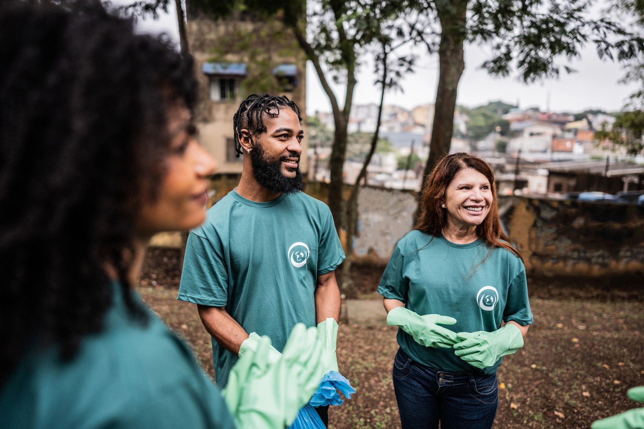 Volunteers talking together in a public park